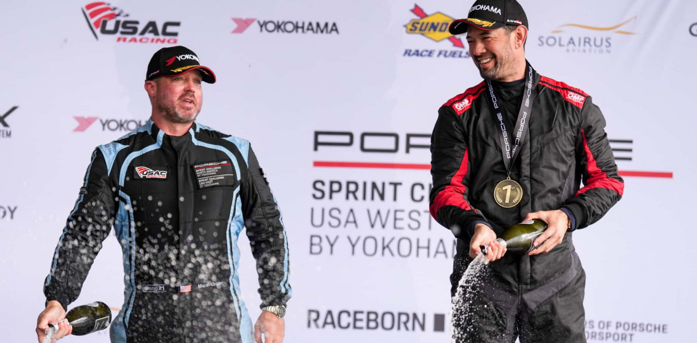 Brannan Hankins celebrating on the podium, Porsche Sprint Challenge USA West